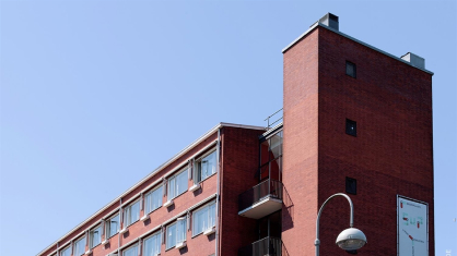 Top of the building with a broedplaats banner visible